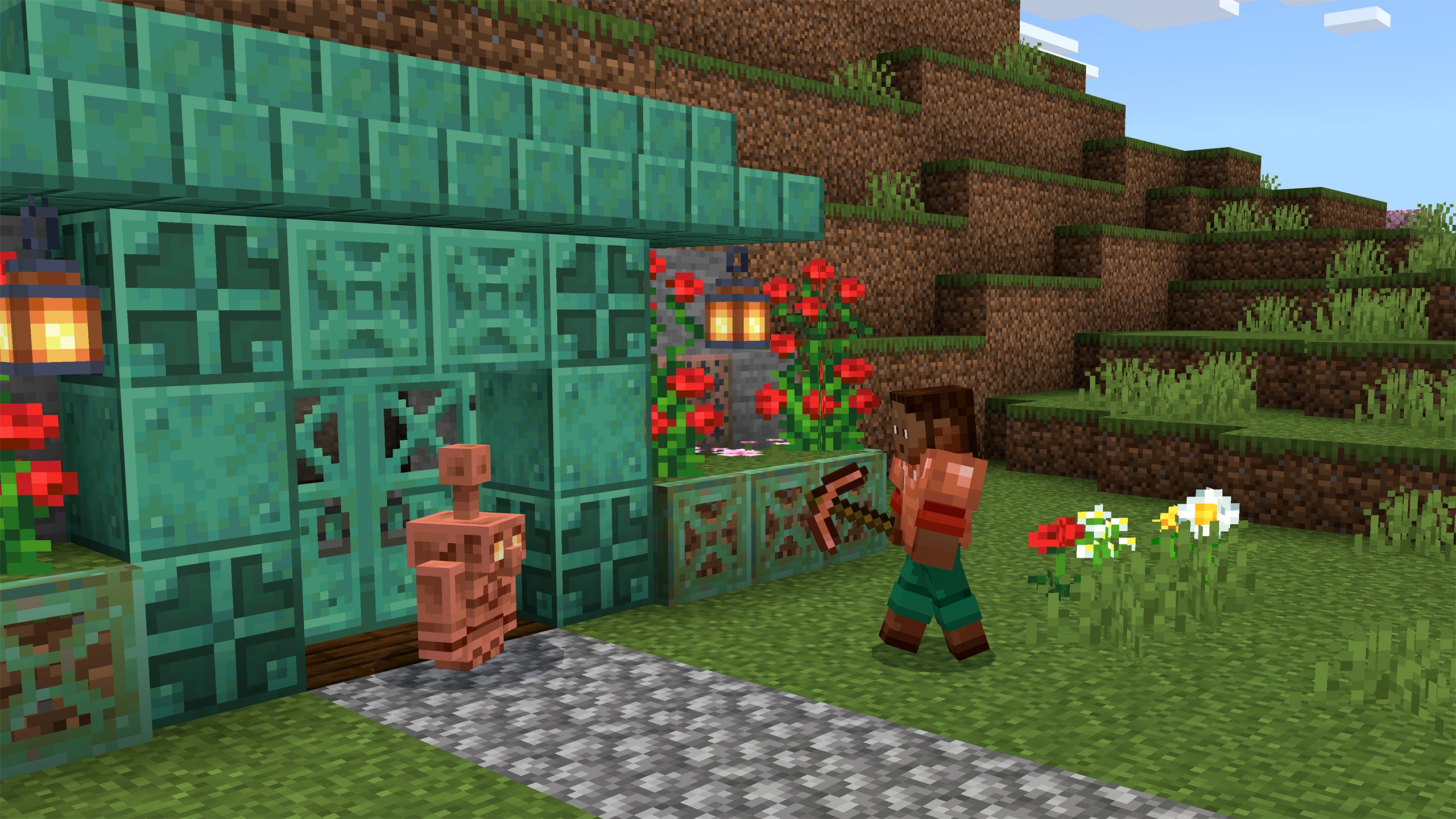 A player with a pickaxe walks toward a copper golem outside a turquoise copper house on a grassy hillside.