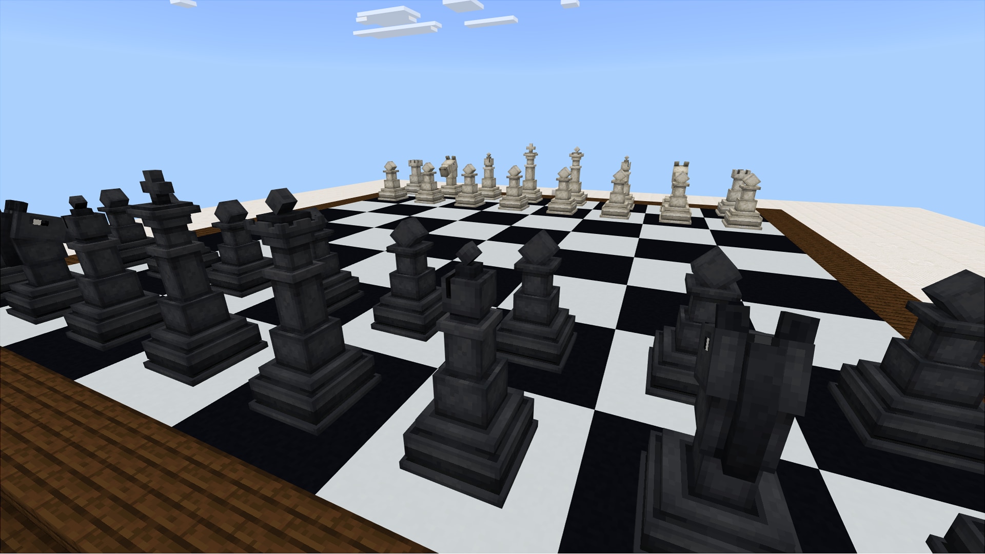Black and white Minecraft chess pieces are set up for a match on a giant checkered board.