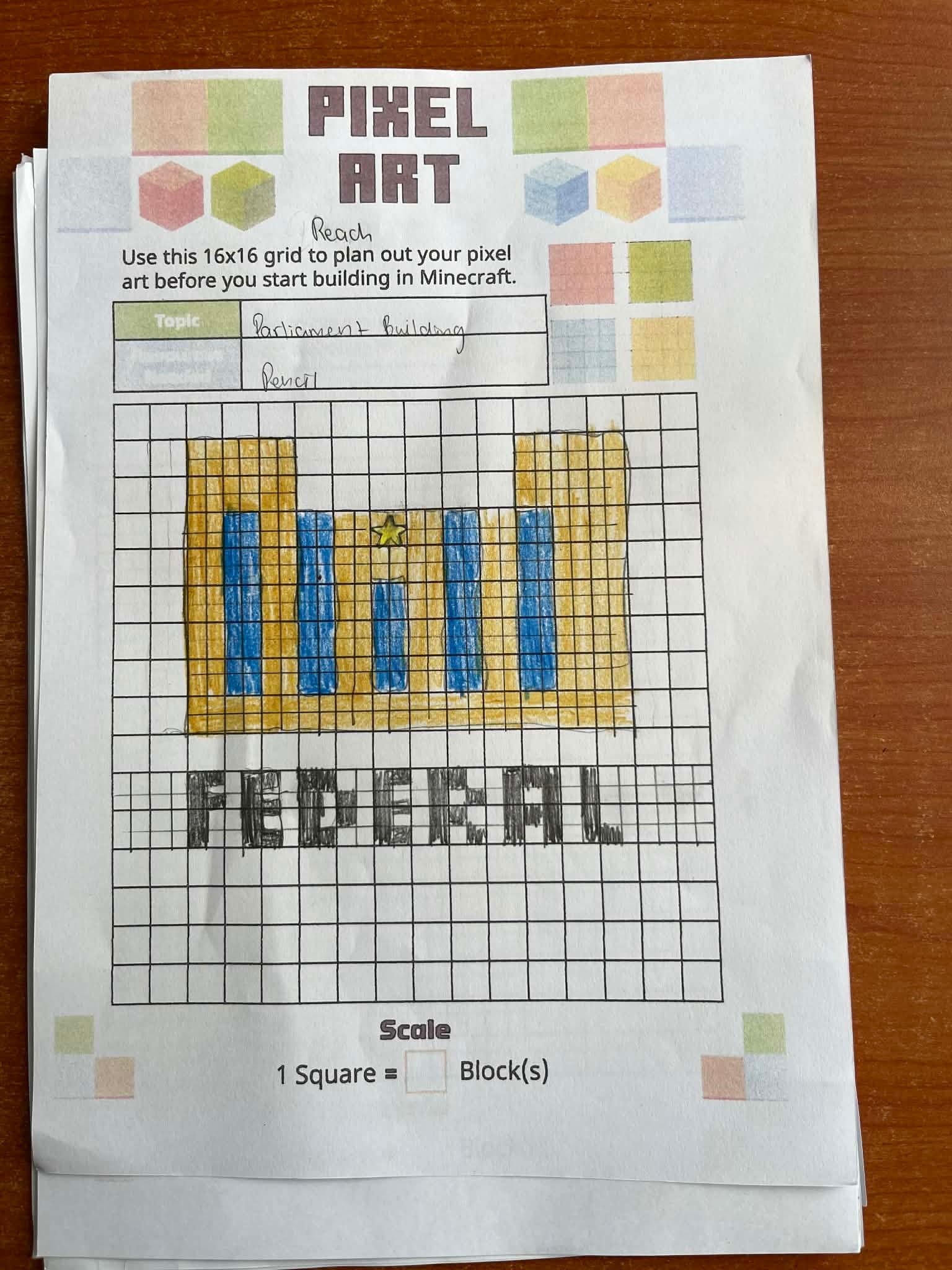 A student's pixel art planning worksheet with a colorful drawing of a building on a 16x16 grid.