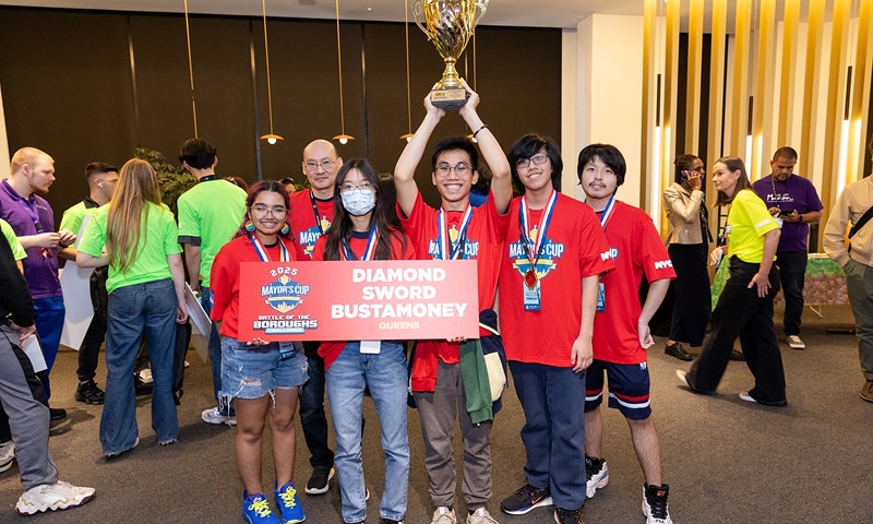 Team of kids holding up trophy