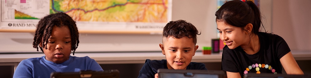 Three kids on a tablet