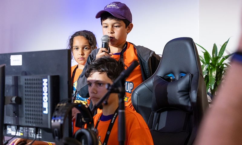 A kid holding a mic