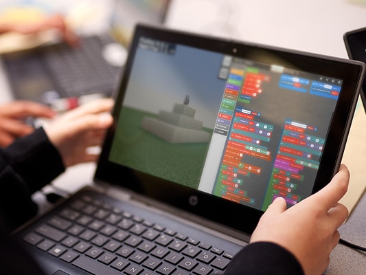 Minecraft Education is being used on a laptop.